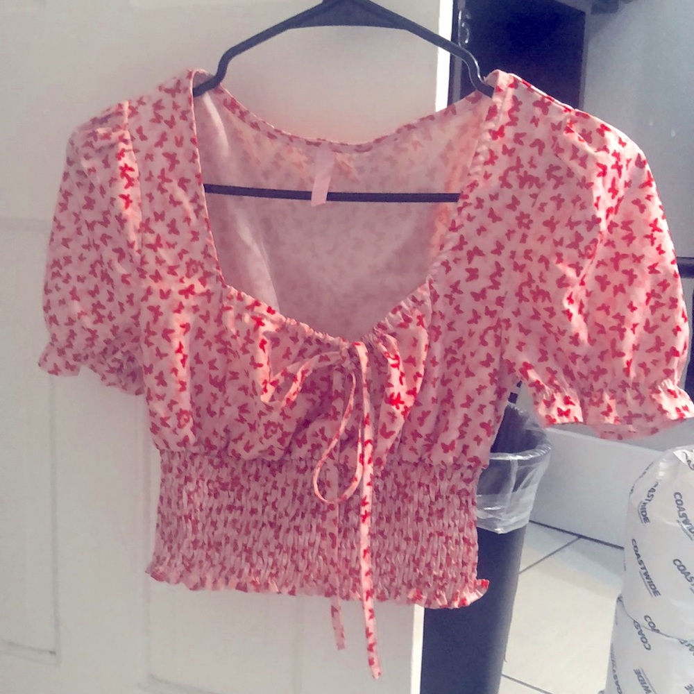 This really pretty crop top butterfly shirt is a pink and red cute girly top
